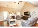 Inviting living room with vaulted ceilings, a cozy fireplace, and comfortable seating arrangement at 208 Summer Chase, Carrollton, GA 30116