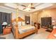 Comfortable bedroom featuring a ceiling fan, four-poster bed, and stylish decor at 208 Summer Chase, Carrollton, GA 30116