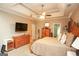 A cozy bedroom featuring a flat screen television and natural wooden furniture at 208 Summer Chase, Carrollton, GA 30116