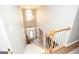 Grand staircase leading to the front entrance, enhanced by a chandelier and a large window at 208 Summer Chase, Carrollton, GA 30116