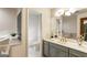 Serene bathroom boasts a separate tub and toilet area, complemented by stylish vanities and a clean design at 1875 Bernice Dr, Cumming, GA 30041