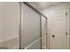 Shower with glass doors and tiled surround at 1875 Bernice Dr, Cumming, GA 30041