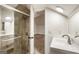 Bright bathroom with modern vanity and a glass shower door with beautiful tile at 1875 Bernice Dr, Cumming, GA 30041