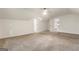 Spacious bedroom features neutral carpet, white walls, and an open doorway at 1875 Bernice Dr, Cumming, GA 30041