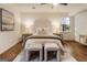 Cozy bedroom with a stylish headboard, lamps, and bedside tables, exuding a serene and inviting atmosphere at 1875 Bernice Dr, Cumming, GA 30041