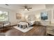 Sun-filled bedroom with modern furniture and hardwood floors at 1875 Bernice Dr, Cumming, GA 30041