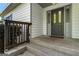A close-up of the front door reveals decorative glass and a tidy entryway at 1875 Bernice Dr, Cumming, GA 30041