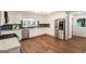 Bright kitchen with stainless appliances, a large window, and wood flooring provides a delightful cooking space at 1875 Bernice Dr, Cumming, GA 30041