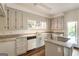 Bright kitchen with granite countertops and ample cabinet space at 1875 Bernice Dr, Cumming, GA 30041