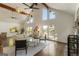 Open living room with fireplace, vaulted ceiling, and hardwood floors at 1875 Bernice Dr, Cumming, GA 30041