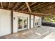 Covered patio with exposed wood ceiling and lighting at 1875 Bernice Dr, Cumming, GA 30041