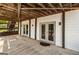 Covered patio with exposed wood ceiling and lighting at 1875 Bernice Dr, Cumming, GA 30041