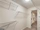 Walk-in closet with wire shelving for organized storage space at 1875 Bernice Dr, Cumming, GA 30041