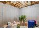 Unfinished basement ready for customizing with exposed ceiling and concrete walls at 1202 Persimmon Way, Mcdonough, GA 30252