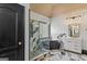Bright bathroom with a sleek black standalone tub, unique tile, and modern vanity at 1202 Persimmon Way, Mcdonough, GA 30252