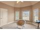 Cozy bedroom with chair and lots of natural light from two windows at 1202 Persimmon Way, Mcdonough, GA 30252
