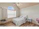 Bedroom featuring light-colored wood floors and a large window to let the sunlight in at 1202 Persimmon Way, Mcdonough, GA 30252