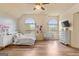 Large bedroom features lots of sunlight from windows and a large television at 1202 Persimmon Way, Mcdonough, GA 30252
