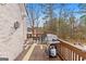 Outdoor deck featuring a grill and seating area, ideal for relaxation and entertaining at 1202 Persimmon Way, Mcdonough, GA 30252