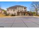 Expansive home exterior featuring a large deck and a covered swimming pool, offering plenty of outdoor space at 1202 Persimmon Way, Mcdonough, GA 30252