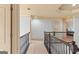 View of upstairs hallway featuring railing and rooms nearby at 1202 Persimmon Way, Mcdonough, GA 30252