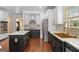 Modern kitchen with stainless steel appliances, updated countertops, and stylish hardware at 1202 Persimmon Way, Mcdonough, GA 30252