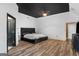 Spacious main bedroom featuring wood floors, ceiling fan, and modern finishes at 1202 Persimmon Way, Mcdonough, GA 30252