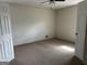 A bright and airy bedroom with carpet floors, ceiling fan, and neutral walls at 2195 Wilson Nw Rd, Conyers, GA 30012