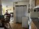 A view from the kitchen showing into the living room with a white freezer, white stove and access to living room at 2195 Wilson Nw Rd, Conyers, GA 30012