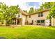 Large backyard with manicured lawn and mature trees, offering privacy and space for outdoor activities at 130 Brooklet Way, Brooks, GA 30205