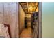 Unfinished basement with concrete walls, exposed ceiling, and shelving for ample storage at 130 Brooklet Way, Brooks, GA 30205