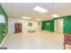Spacious basement with green accent wall and vinyl flooring at 130 Brooklet Way, Brooks, GA 30205