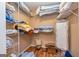 Spacious walk-in closet with built-in shelving and wood floors, perfect for storage at 130 Brooklet Way, Brooks, GA 30205