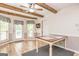 Cozy dining area with wood table, natural light, and backyard access at 130 Brooklet Way, Brooks, GA 30205