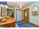Welcoming foyer features a wooden door, patterned rug, and classic decor for a warm entry at 130 Brooklet Way, Brooks, GA 30205