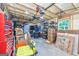 Well-lit garage with shelving, windows, and ample storage space for tools and equipment at 130 Brooklet Way, Brooks, GA 30205