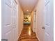 Inviting hallway featuring wood floors and an open view to the bedroom at 130 Brooklet Way, Brooks, GA 30205