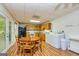 Basement kitchenette with wooden cabinets, appliances, and a dining table at 130 Brooklet Way, Brooks, GA 30205