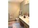 Well-lit bathroom with a marble countertop vanity and a classic fixtures adding a touch of elegance at 305 Glenloch Ln, Stockbridge, GA 30281