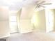 Bright bedroom with neutral walls, carpeted floors, and a unique architecture, enhanced by a ceiling fan at 305 Glenloch Ln, Stockbridge, GA 30281
