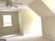 Inviting bedroom with a ceiling fan and carpeted floors, filled with natural light from the window at 305 Glenloch Ln, Stockbridge, GA 30281