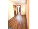 Hallway with hardwood floors offers views of additional rooms at 305 Glenloch Ln, Stockbridge, GA 30281