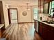 Open floor plan eat-in kitchen includes stainless steel appliances, bay window and hardwood floors at 305 Glenloch Ln, Stockbridge, GA 30281
