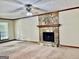 Living room with stone fireplace, carpeting and neutral walls at 305 Glenloch Ln, Stockbridge, GA 30281