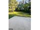 Lush backyard featuring a patio area, perfect for outdoor entertaining and relaxation at 229 Timberland Trl, Riverdale, GA 30274