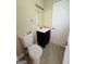 Bathroom featuring a toilet, vanity, and modern fixtures creating a functional space at 229 Timberland Trl, Riverdale, GA 30274