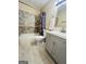 Modern bathroom with tub, shower, toilet, vanity, and updated fixtures for a refreshed look at 229 Timberland Trl, Riverdale, GA 30274