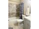 Modern bathroom with tub, shower, toilet, vanity, and updated fixtures for a refreshed look at 229 Timberland Trl, Riverdale, GA 30274