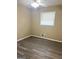 Inviting bedroom with a ceiling fan and stylish gray wood floors, providing a serene atmosphere at 229 Timberland Trl, Riverdale, GA 30274