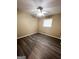 Comfortable bedroom with laminate flooring, neutral walls, and a ceiling fan at 229 Timberland Trl, Riverdale, GA 30274